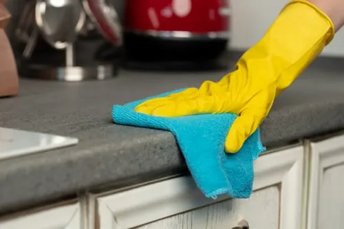 Wiping down a kitchen counter